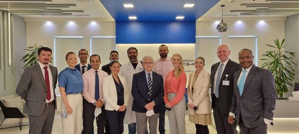 Group photo of Moorfields Eye Hospital team celebrating JCI accreditation.