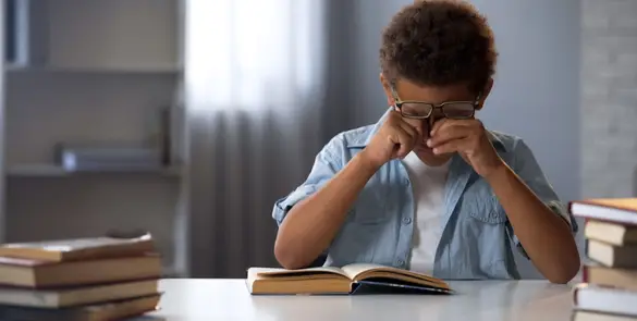 Person rubbing their eye showing a common symptom of irritation or possible allergy